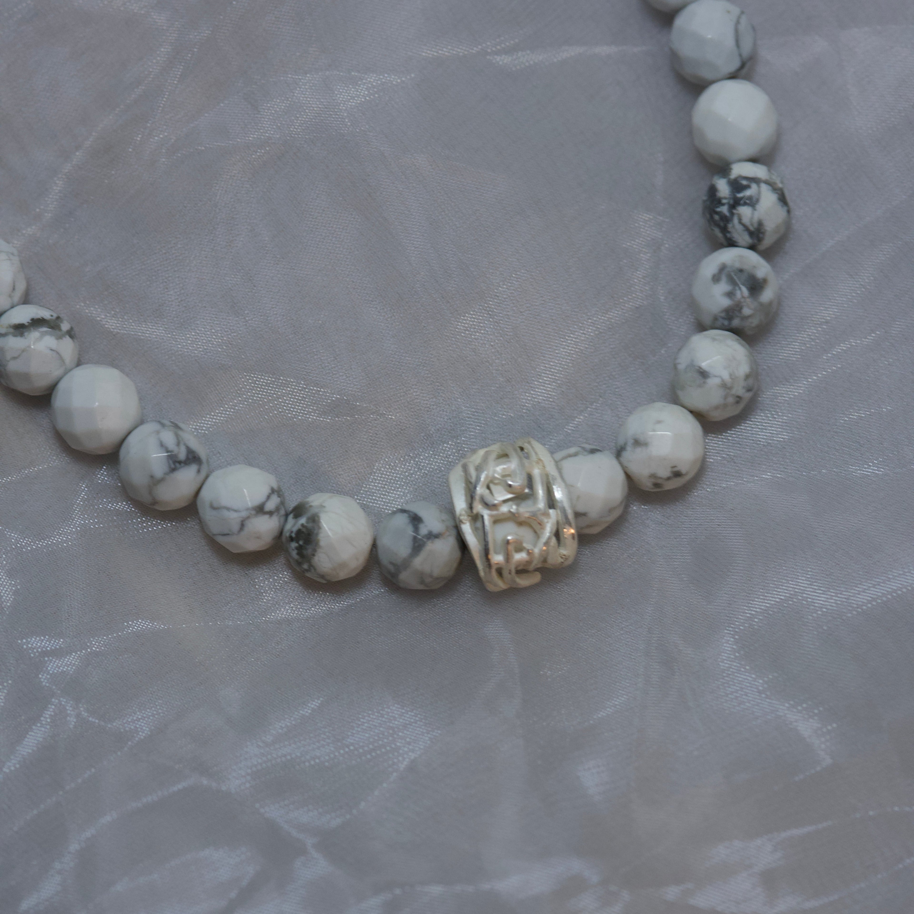 Howlite with logo motif