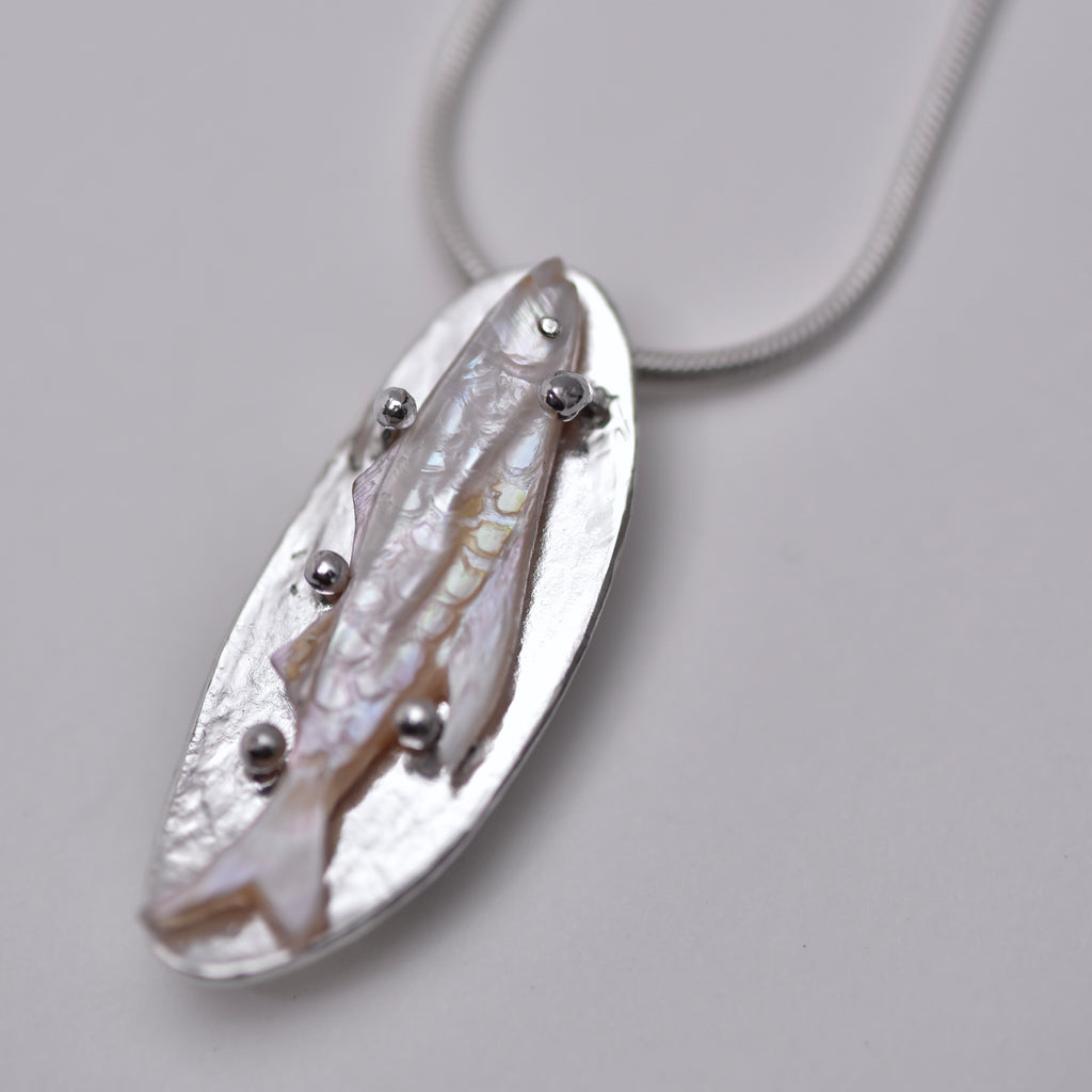 A fish... Pendant necklace