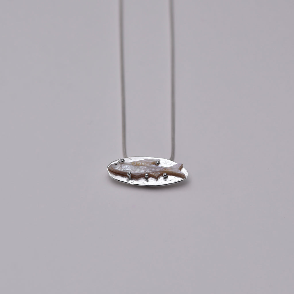A fish... Pendant necklace