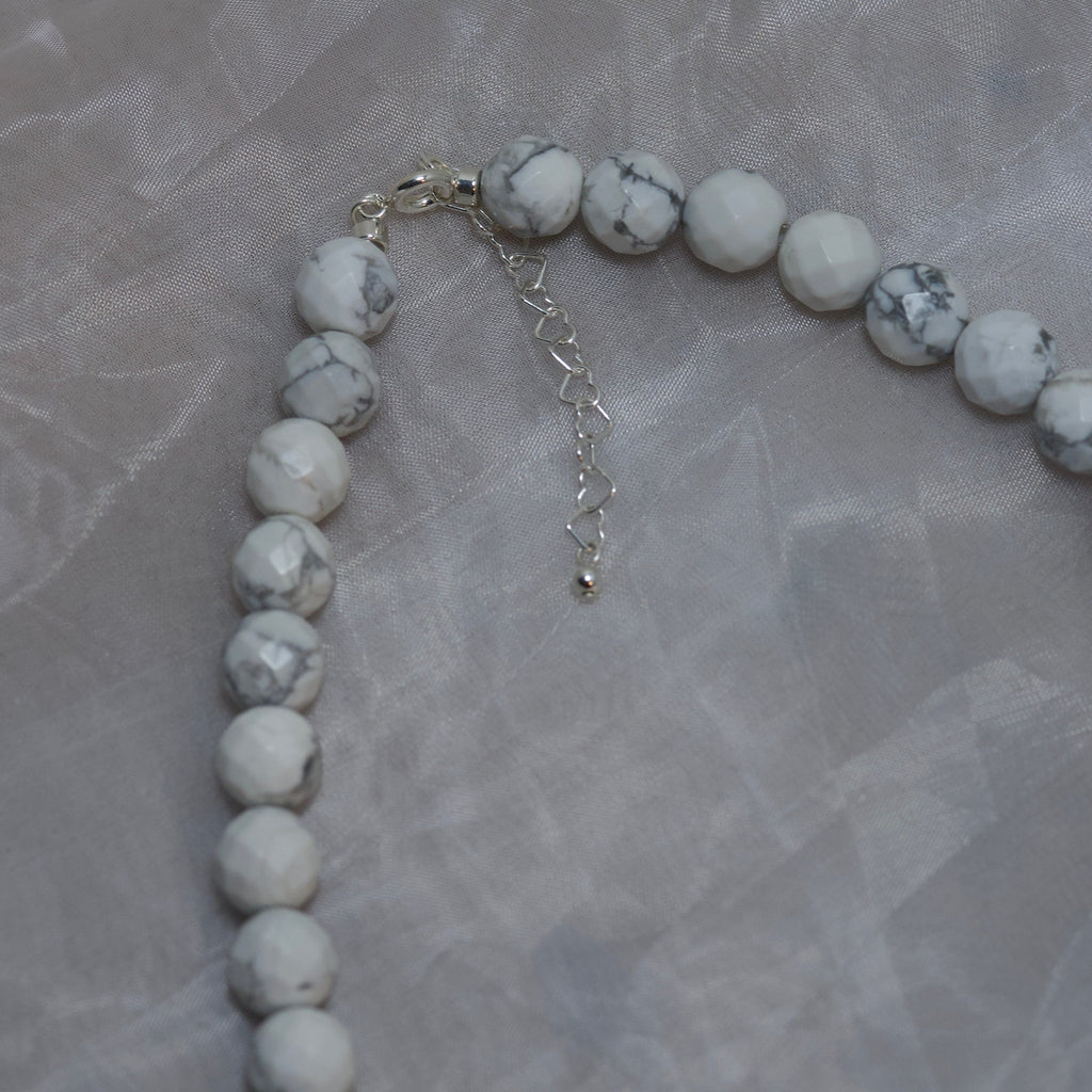 Howlite with logo motif
